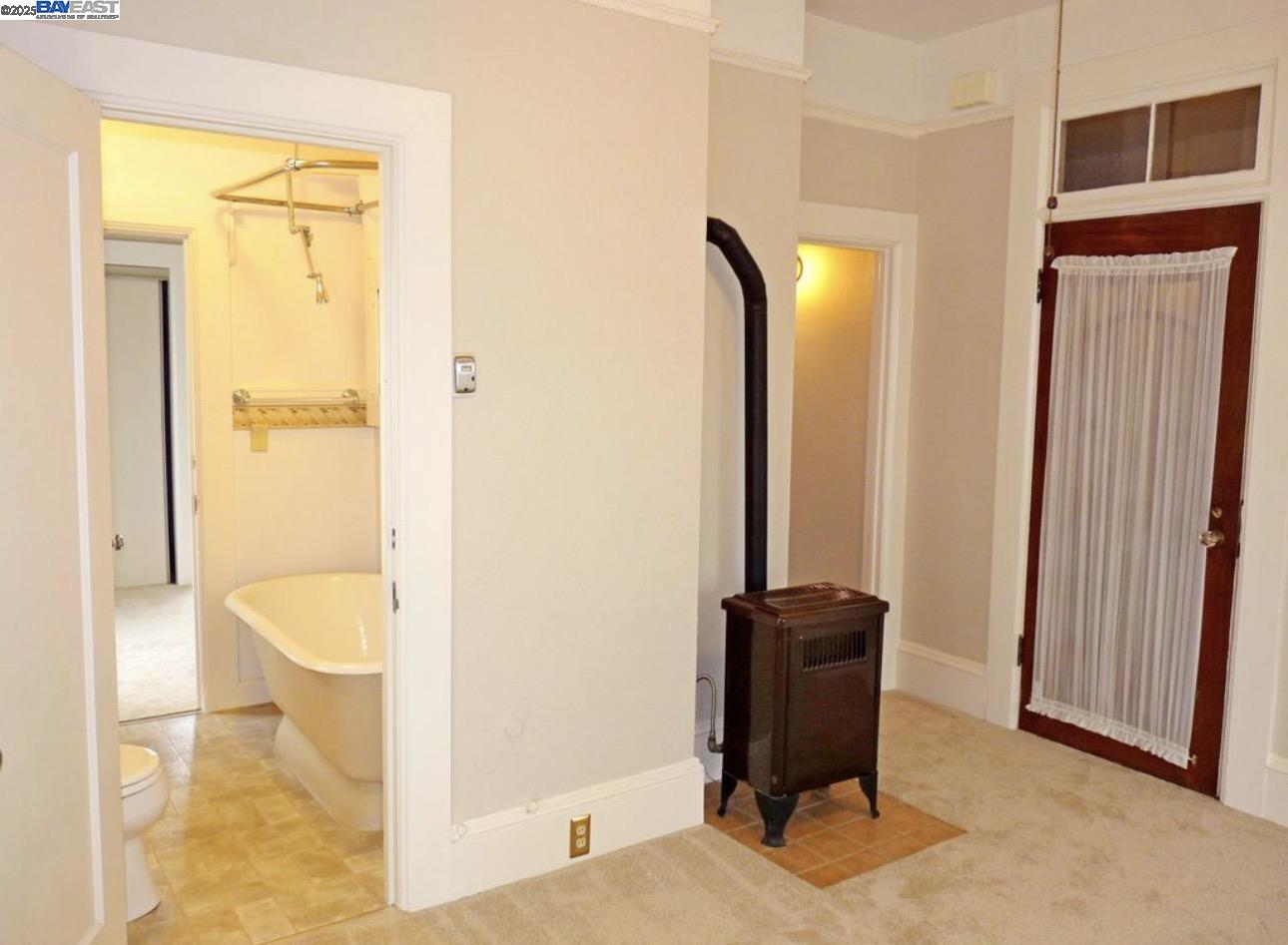 1606 Morton Street Alameda, CA 94501 - Photo 9 of 48 a bathroom with a bathtub and a toilet