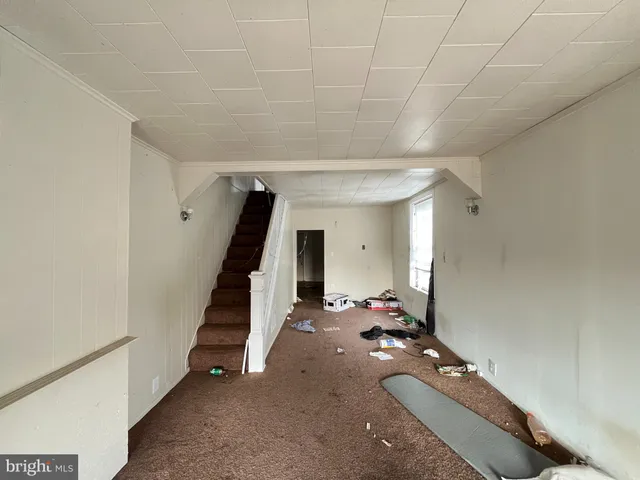 a room with stairs and furniture