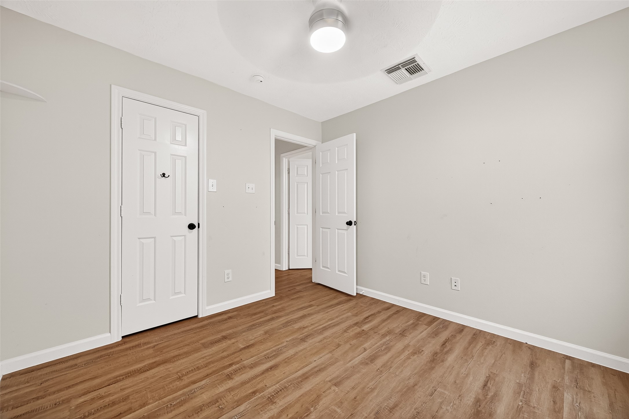 5517 Autumn Ash Lane Rosharon, TX 77583 - Photo 42 of 50 a view of an empty room with wooden floor