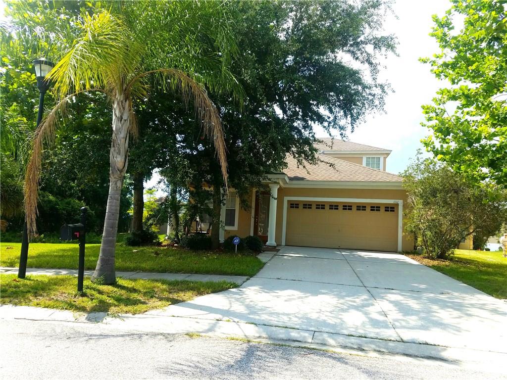 1111 Napolean Way Wesley Chapel, FL 33544 - Photo 1 of 1 front view of a house with a yard