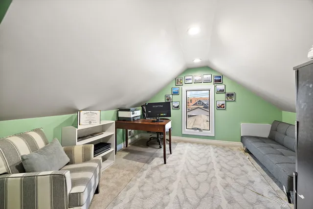 a living room with furniture a rug and a chandelier