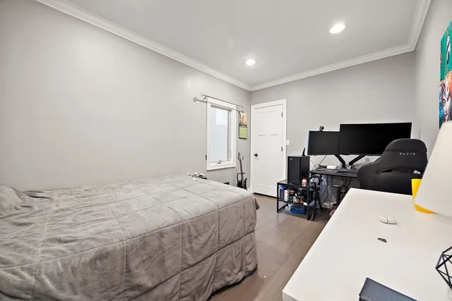 a bed room with a bed and a chair