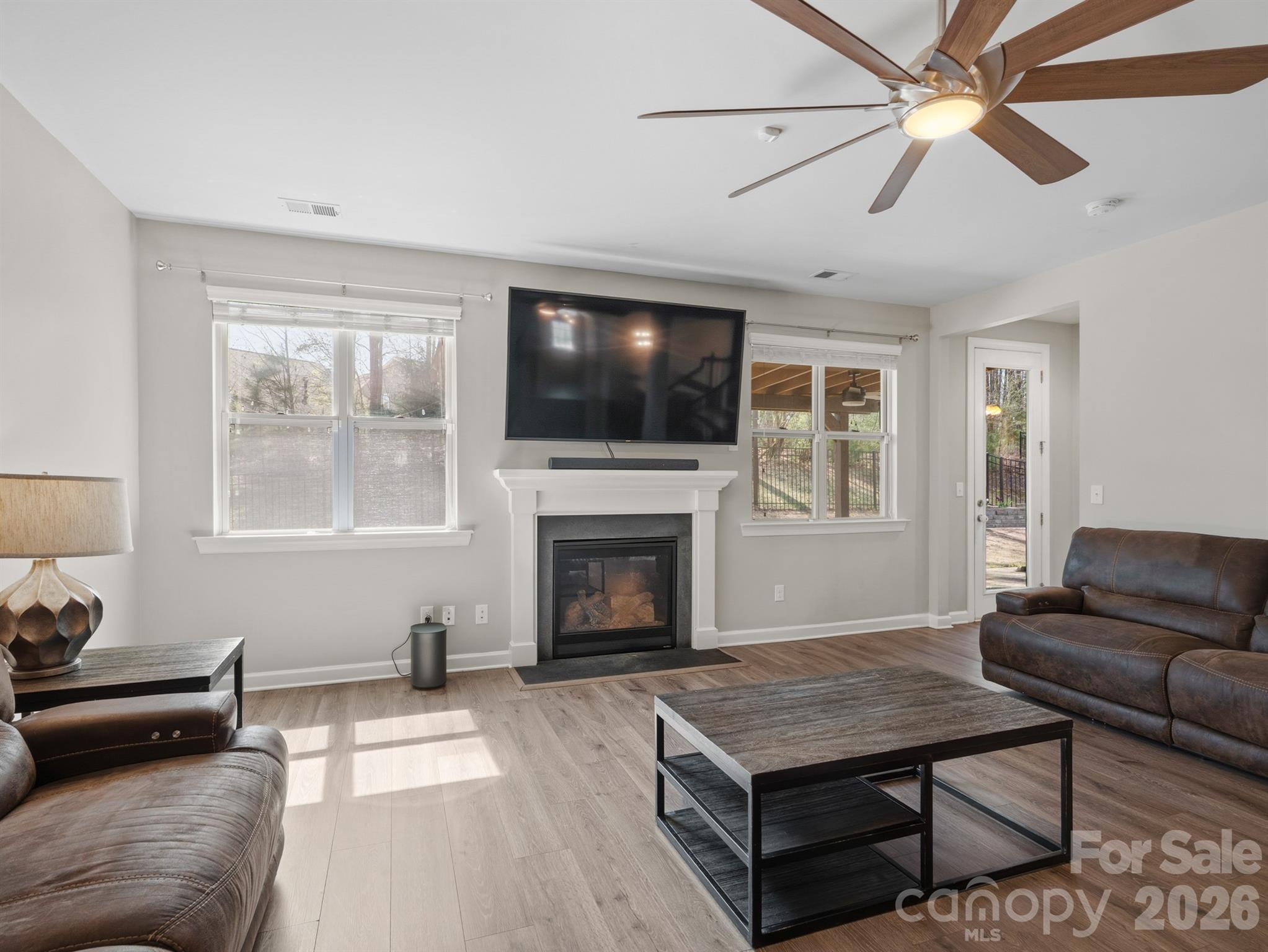 560 Sandbar Point Clover, SC 29710 - Photo 19 of 48 a living room with furniture a flat screen tv and a fireplace