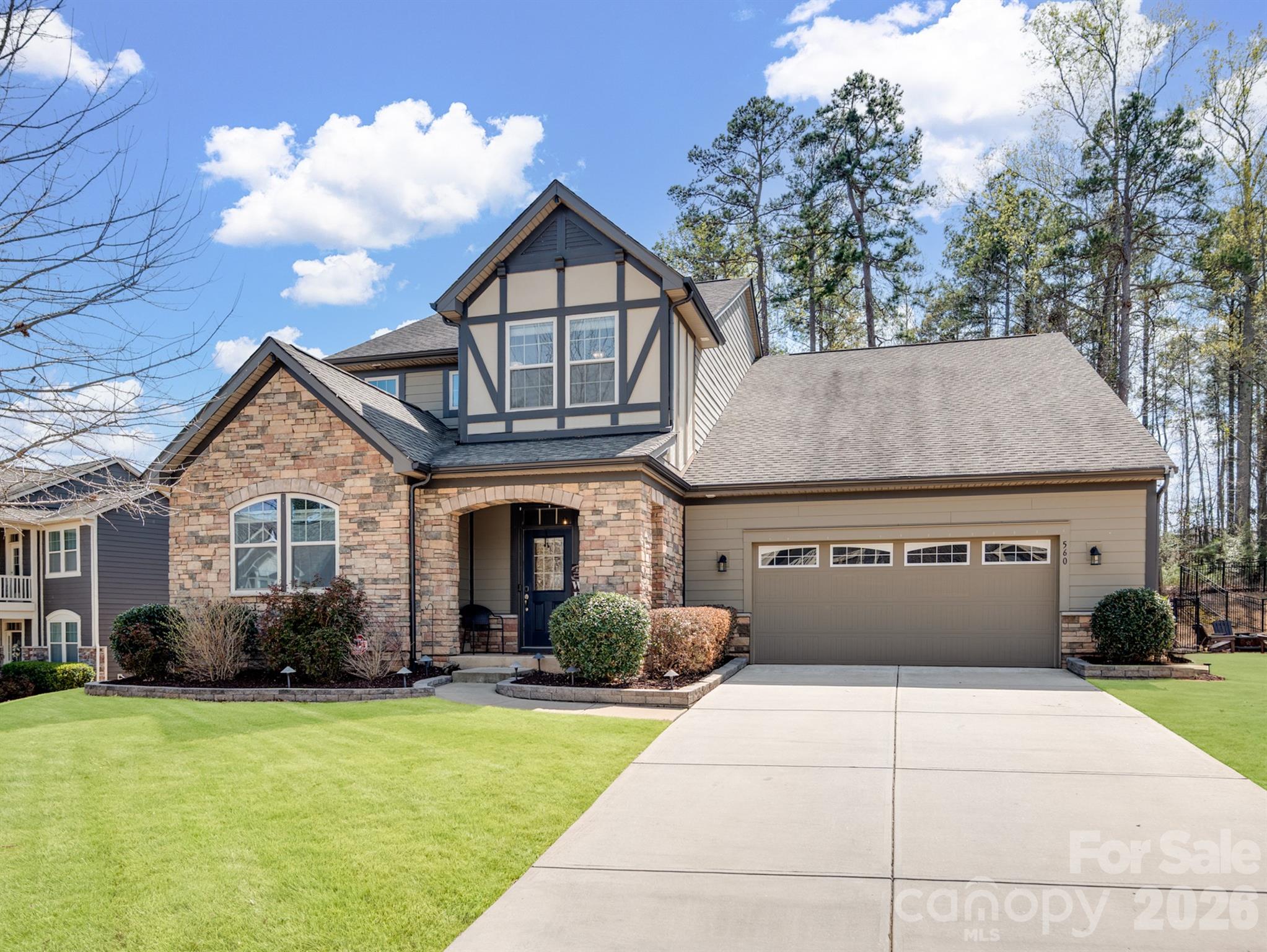 560 Sandbar Point Clover, SC 29710 - Photo 2 of 48 a front view of a house with garden