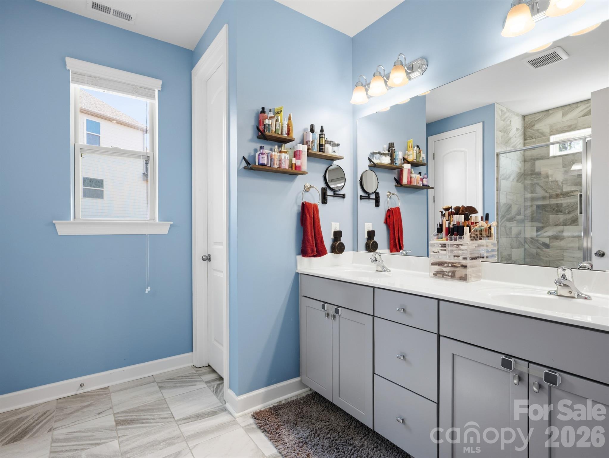 560 Sandbar Point Clover, SC 29710 - Photo 24 of 48 a bathroom with a sink vanity and mirror