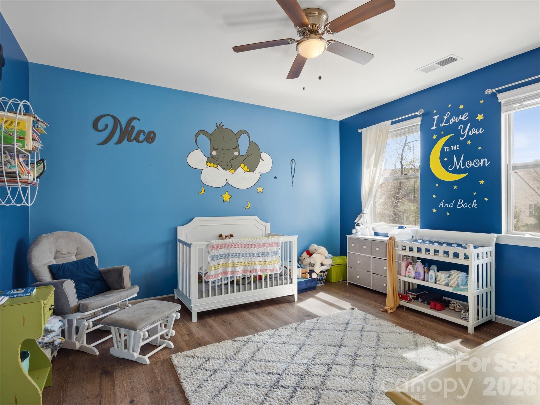 560 Sandbar Point Clover, SC 29710 - Photo 29 of 48 a bedroom with a bed and a chandelier