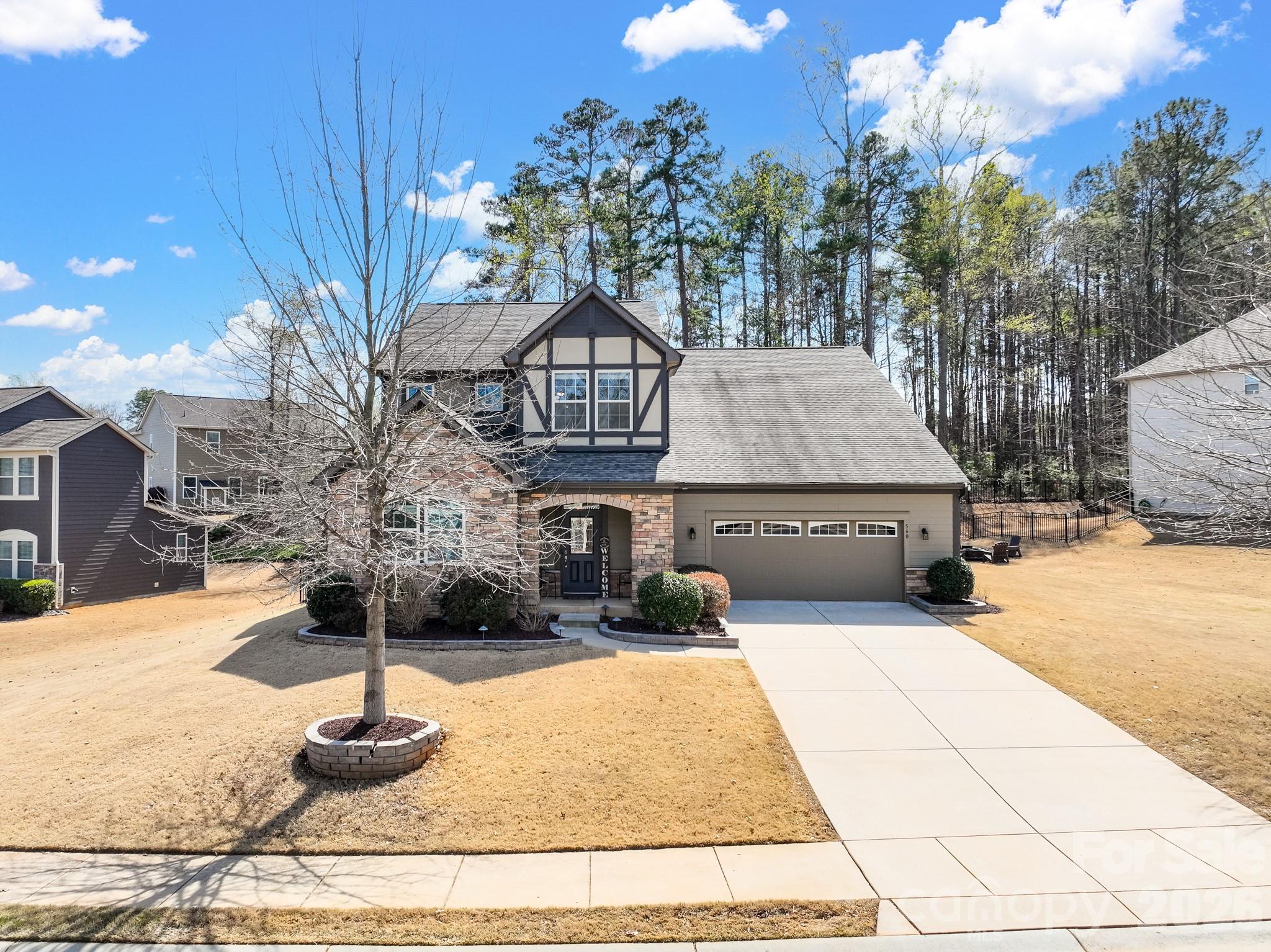 560 Sandbar Point Clover, SC 29710 - Photo 3 of 48 a front view of a house with garden