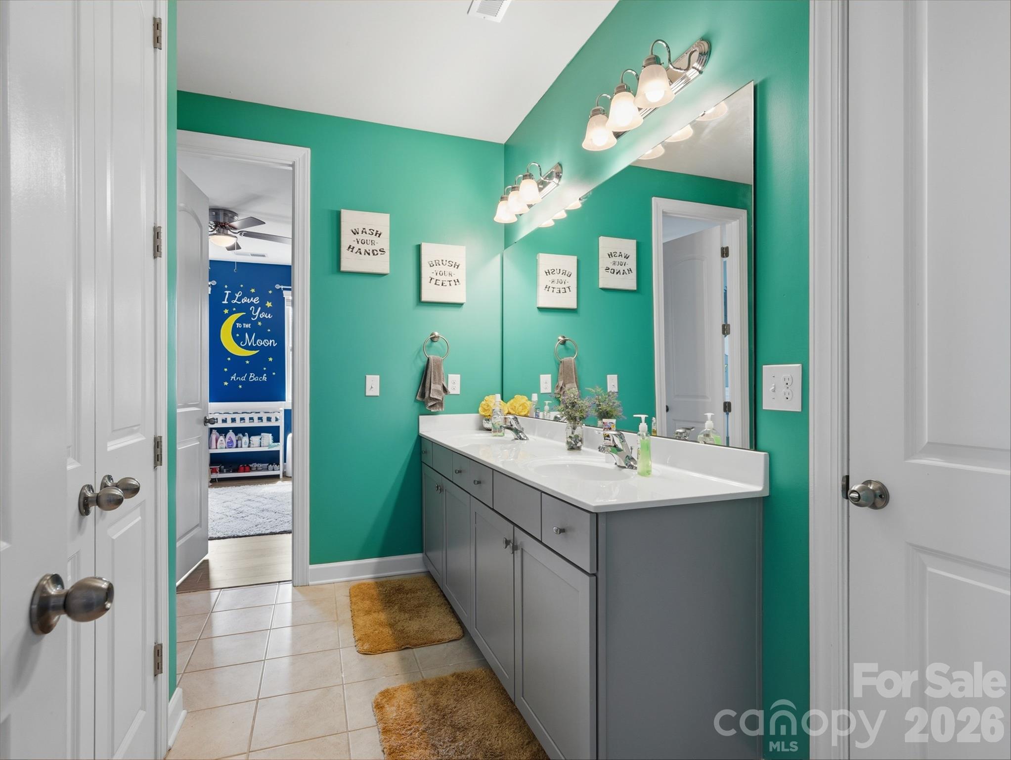 560 Sandbar Point Clover, SC 29710 - Photo 31 of 48 a bathroom with a sink mirror and a shower