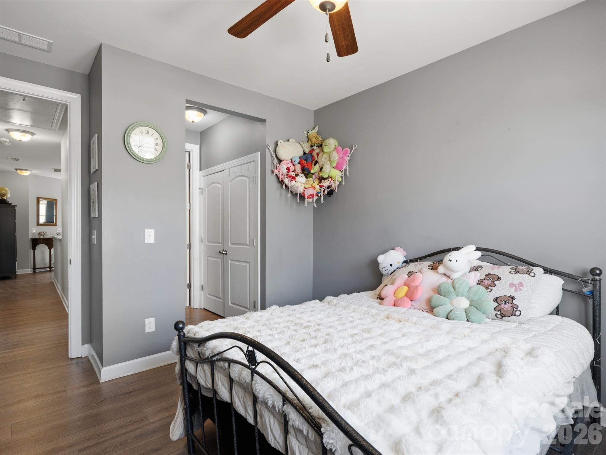 560 Sandbar Point Clover, SC 29710 - Photo 35 of 48 a bedroom with a bed and a chandelier