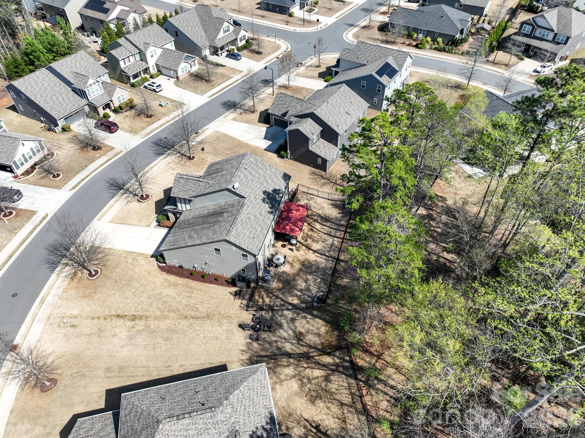 560 Sandbar Point Clover, SC 29710 - Photo 43 of 48 an aerial view of a house with a yard and trees