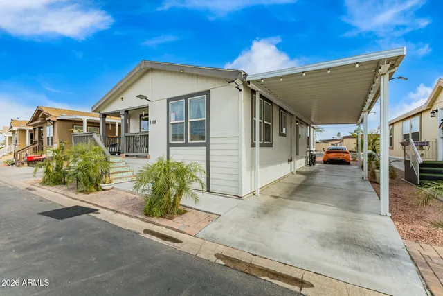 a view of a car park in front of house