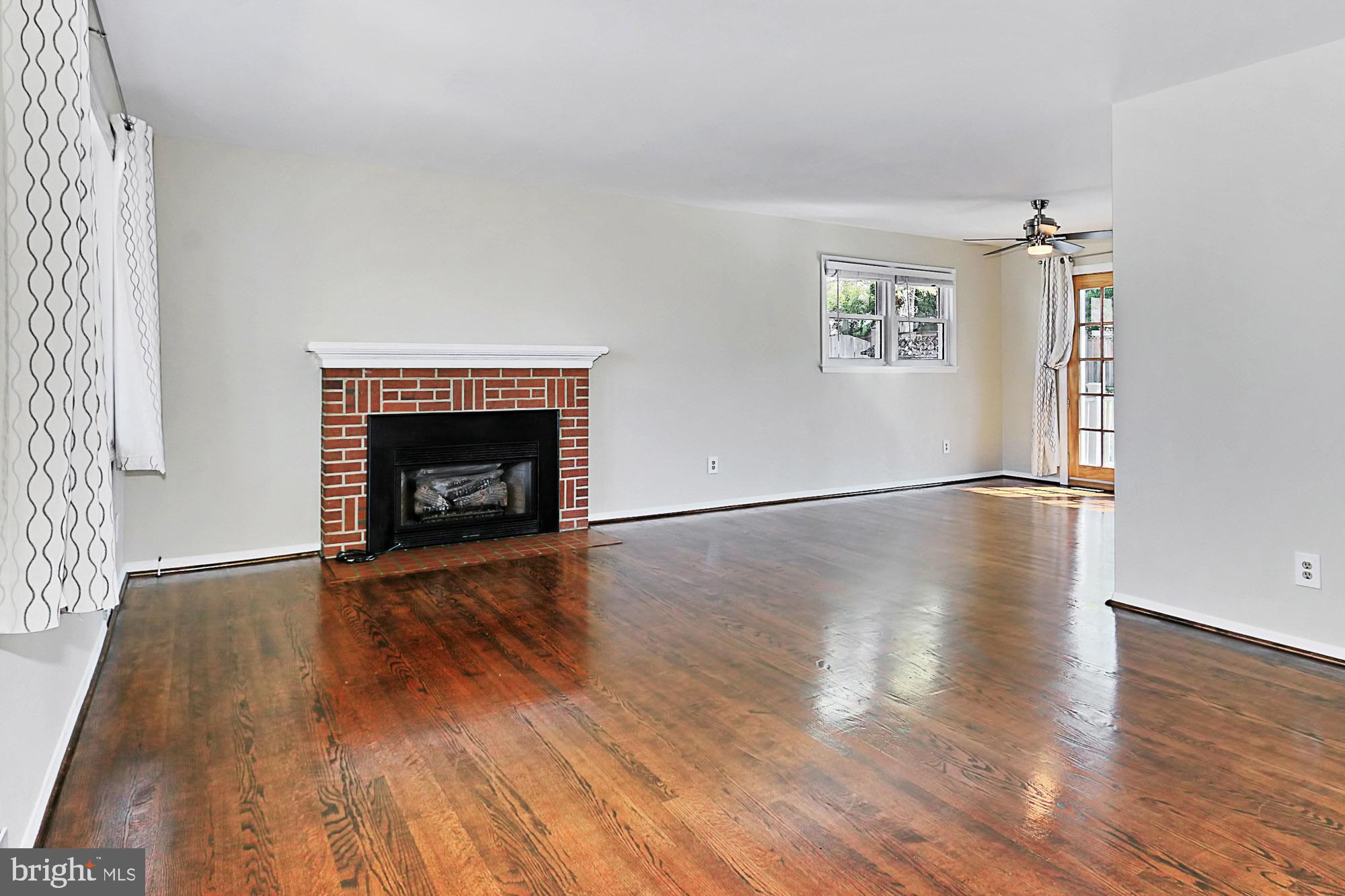 6731 Front Royal Road Springfield, VA 22151 - Photo 5 of 47 Living room with hardwood floors and fireplace