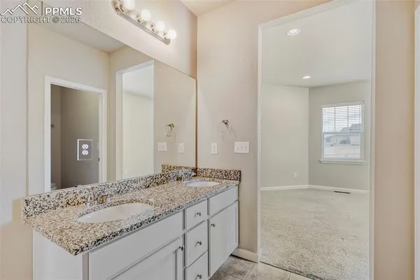a view of an empty room with a bathroom