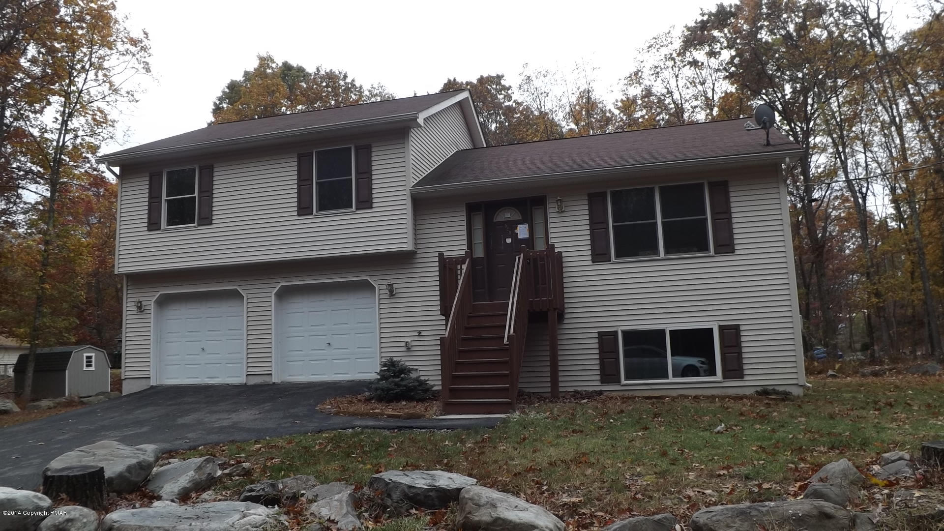 528 Apache Road East Stroudsburg, PA 18302 - Photo 1 of 13 a front view of a house with a yard