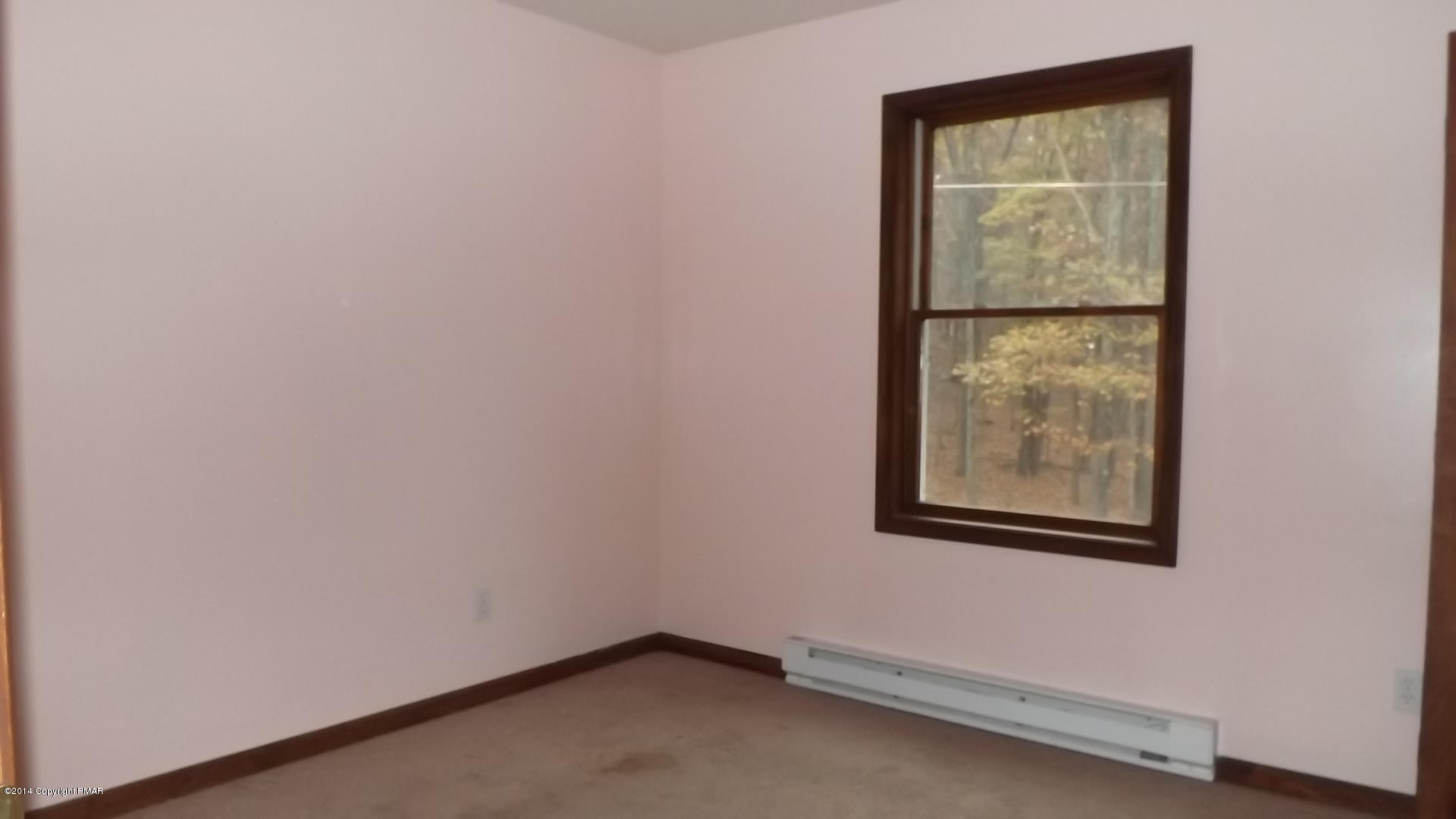 528 Apache Road East Stroudsburg, PA 18302 - Photo 13 of 13 an empty room with a window