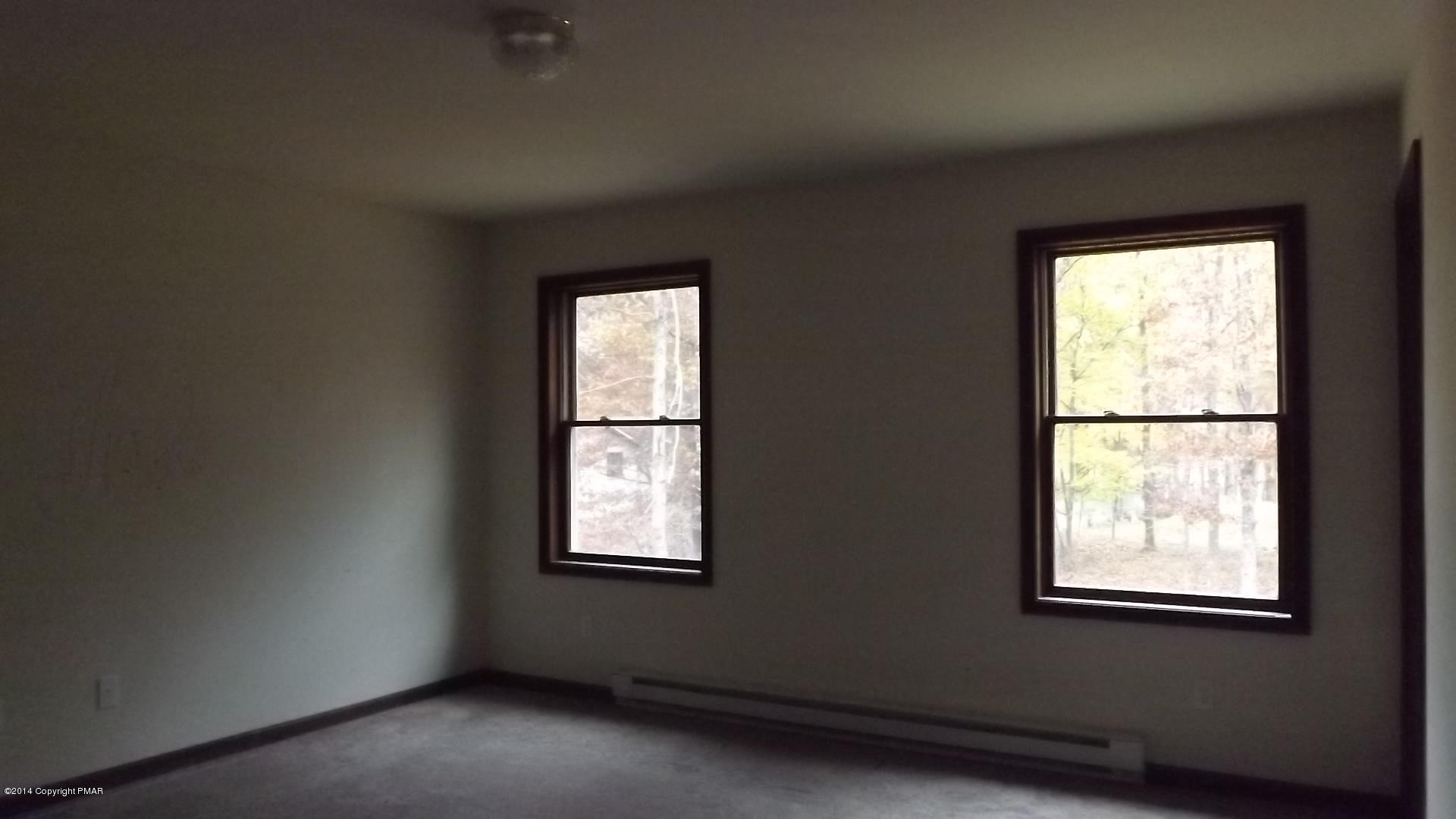 528 Apache Road East Stroudsburg, PA 18302 - Photo 5 of 13 an empty room with a window
