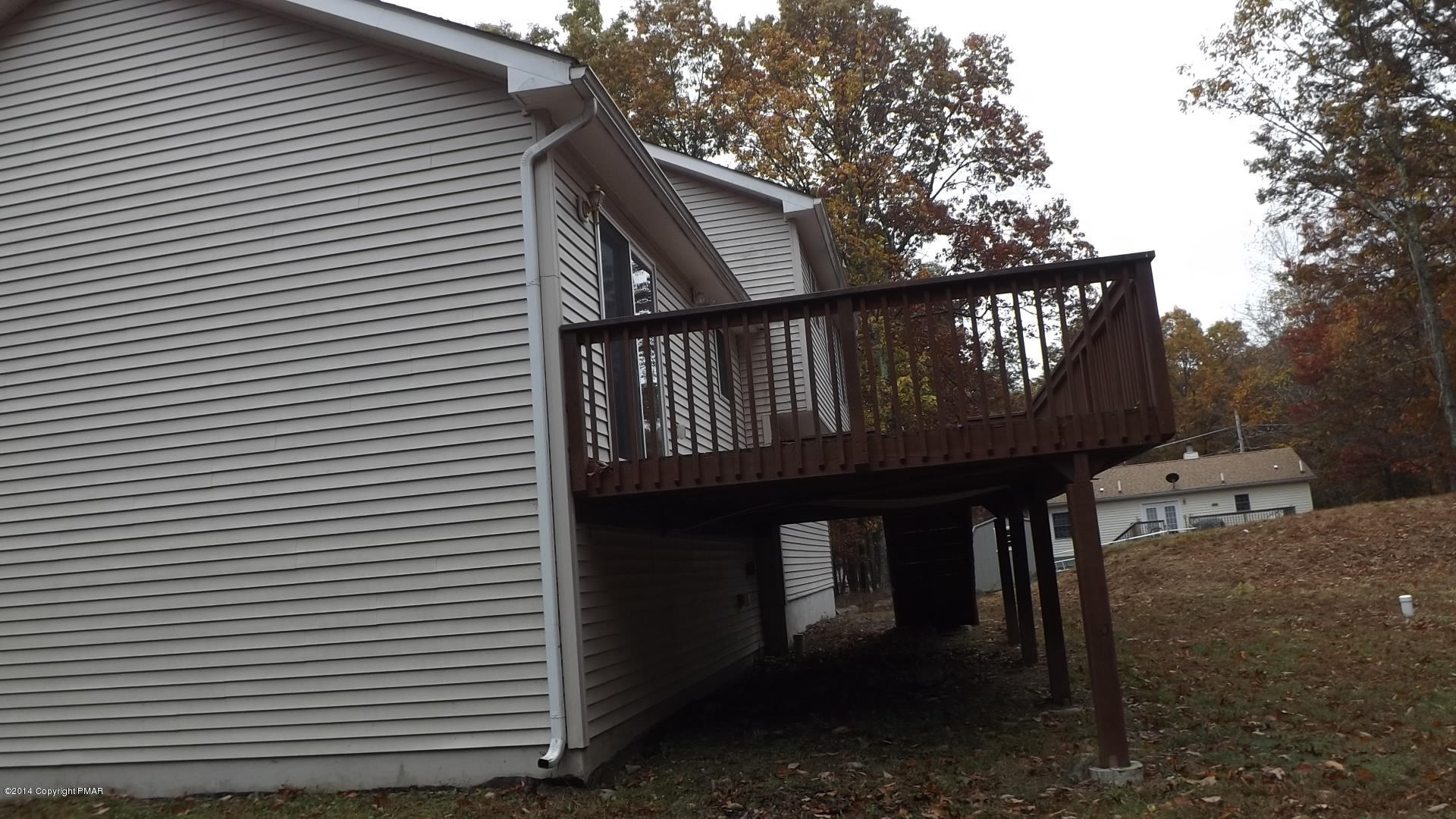528 Apache Road East Stroudsburg, PA 18302 - Photo 8 of 13 a view of a house with a wooden deck