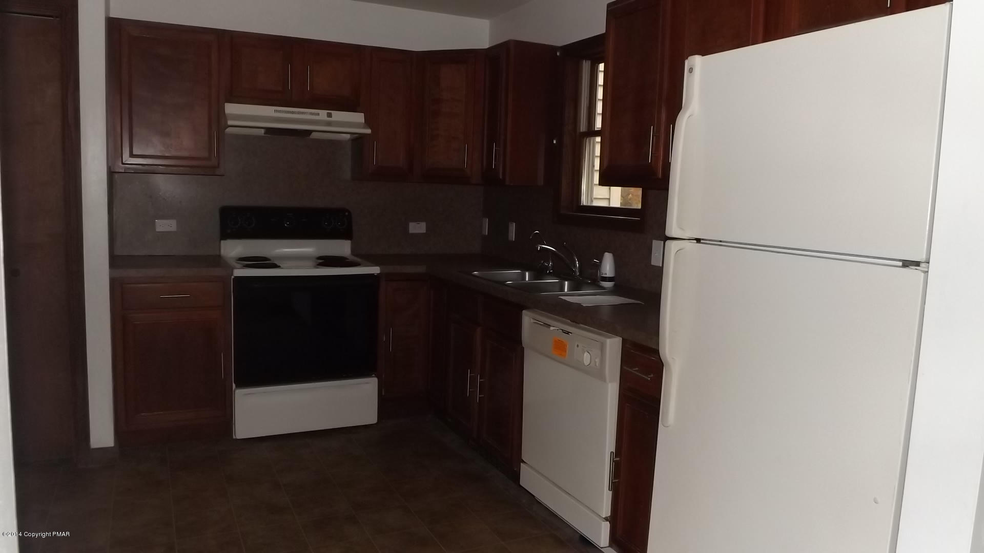 528 Apache Road East Stroudsburg, PA 18302 - Photo 10 of 13 a white refrigerator freezer and a stove sitting inside of a kitchen