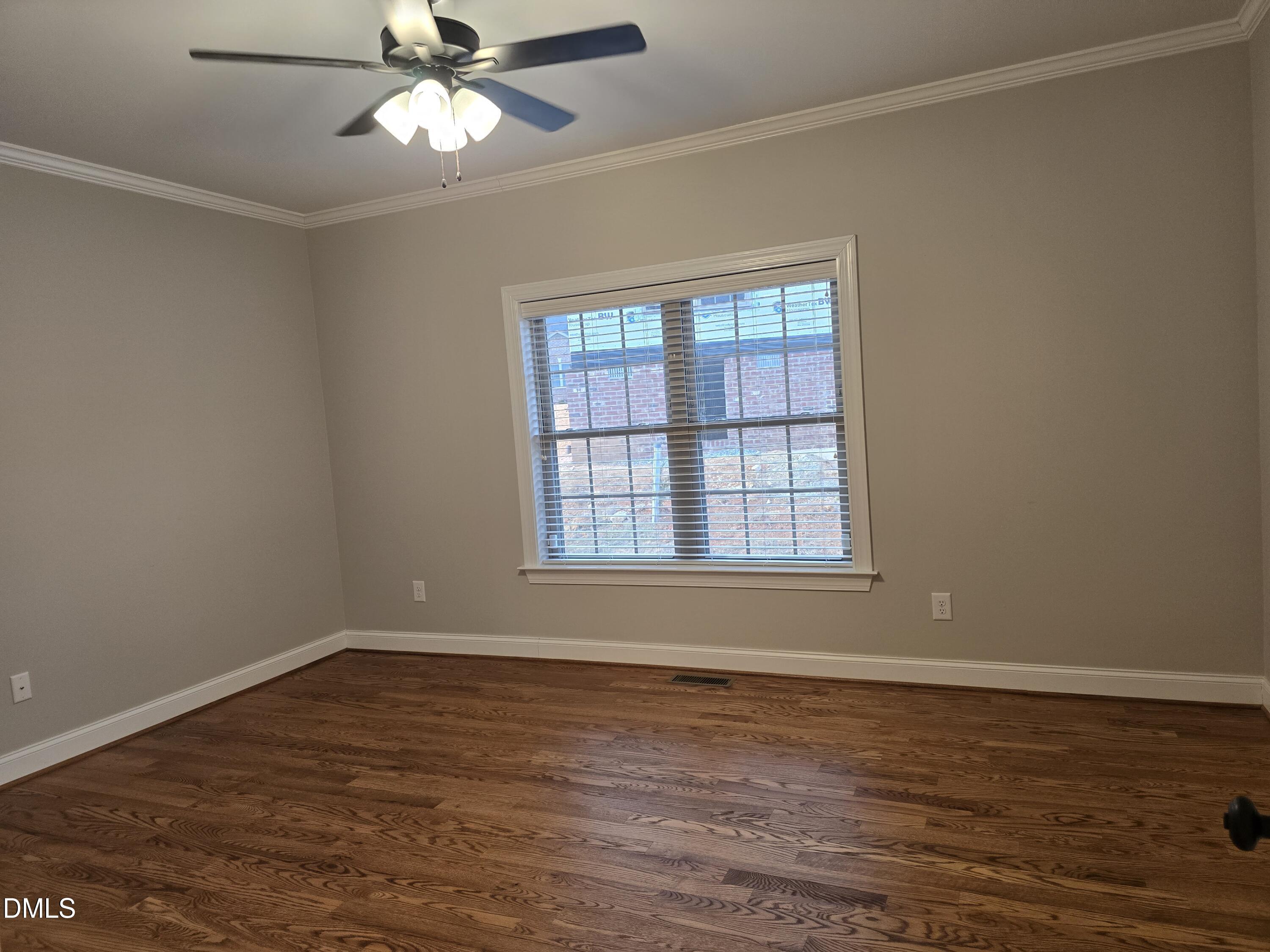 933 Arrowhead Court Mebane, NC 27302 - Photo 45 of 84 a view of wooden floor in an empty room with a window