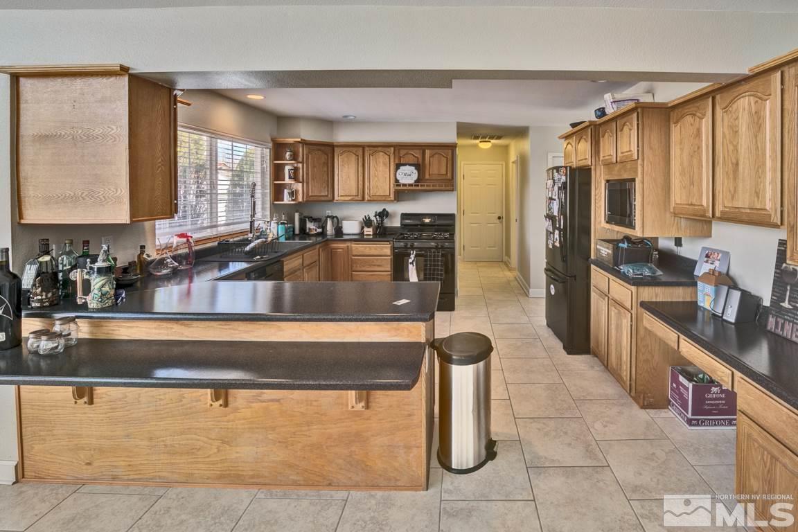 4100 Magnolia Road Fallon, NV 89406 - Photo 14 of 25 a kitchen with a sink and cabinets