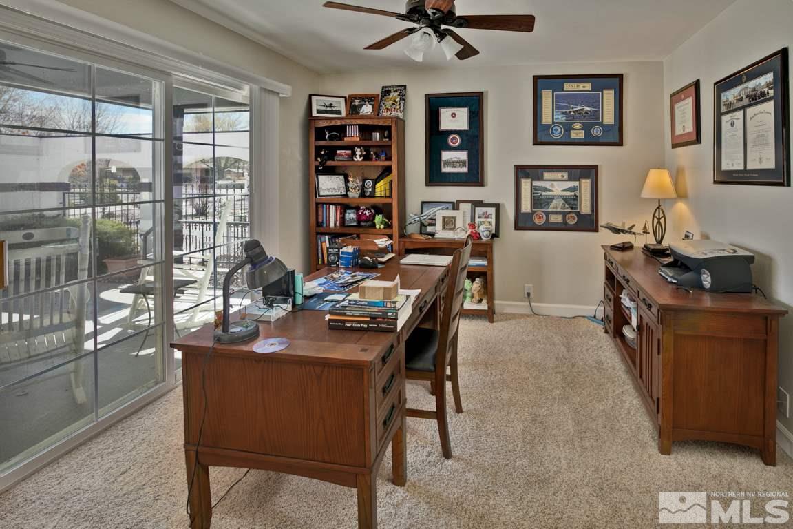 4100 Magnolia Road Fallon, NV 89406 - Photo 21 of 25 a view of a workspace with furniture and a bookshelf