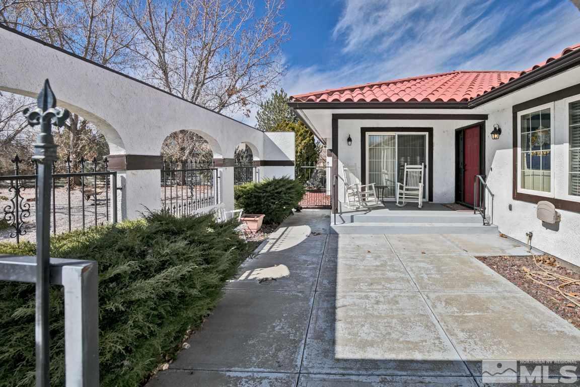 4100 Magnolia Road Fallon, NV 89406 - Photo 3 of 25 a front view of a house with garden