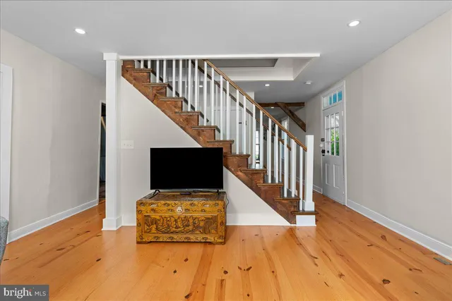 a view of entryway with wooden floor