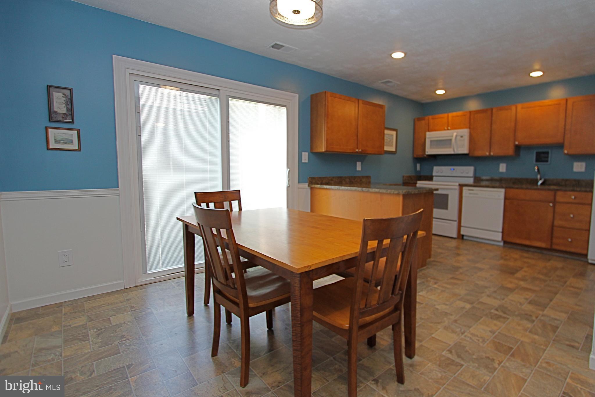 2615 Pearwood Road Baltimore, MD 21234 - Photo 7 of 26 Sliders leading to the 17 x 18 patio!