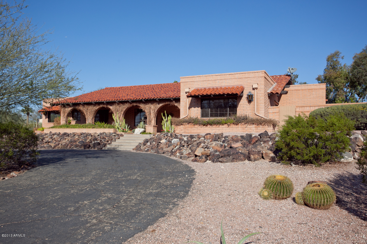4034 East Rancho Drive Phoenix, AZ 85018 - Photo 2 of 38 front view of a house with a yard