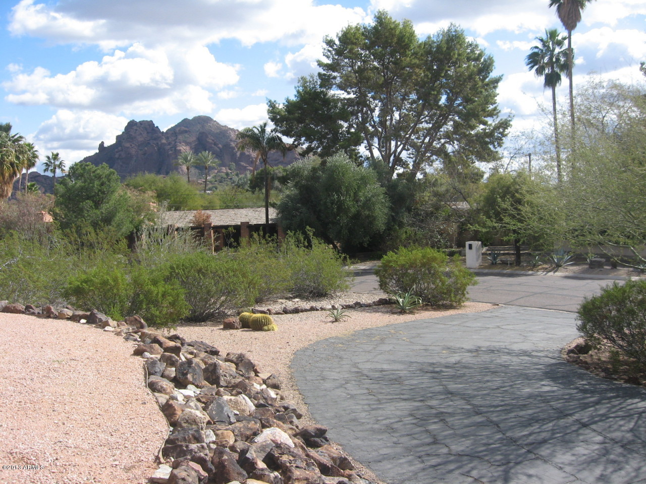 4034 East Rancho Drive Phoenix, AZ 85018 - Photo 3 of 38 a view of a road with a yard