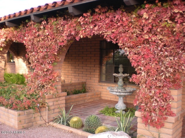 4034 East Rancho Drive Phoenix, AZ 85018 - Photo 5 of 38 a front view of a house with a yard