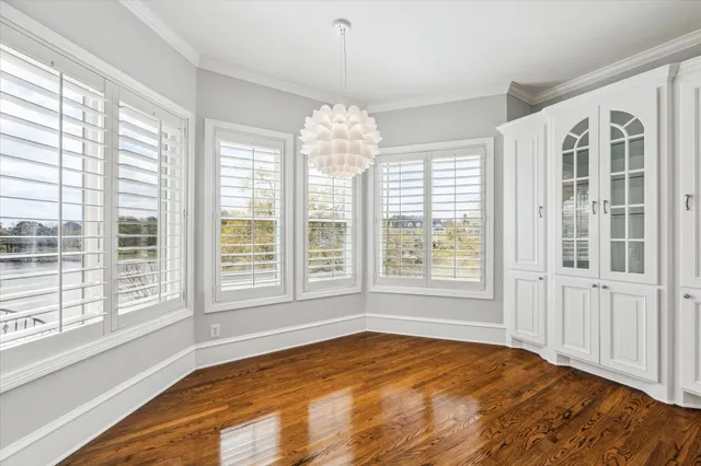 a kitchen with stainless steel appliances granite countertop a stove and cabinets