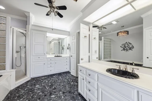 a spacious bathroom with a double vanity sink and a mirror