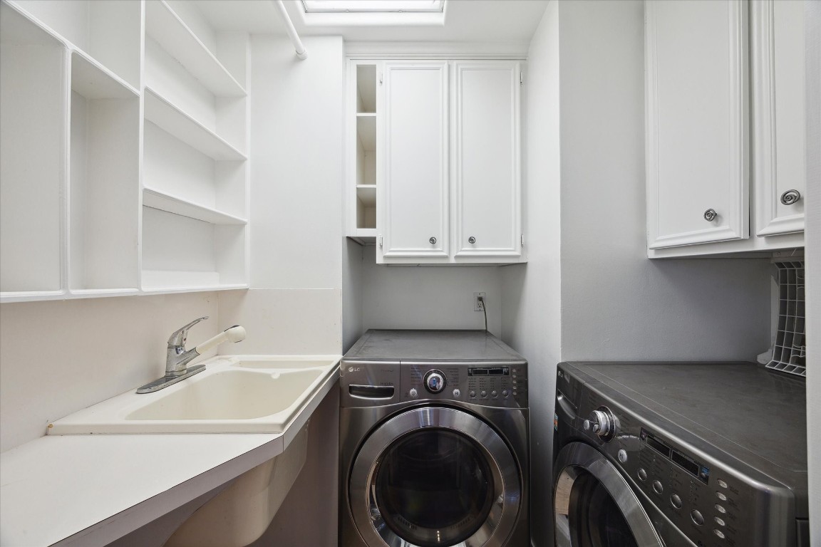 1406 Spring Cress Lane Seabrook, TX 77586 - Photo 27 of 50 a view of a sink and washer and dryer