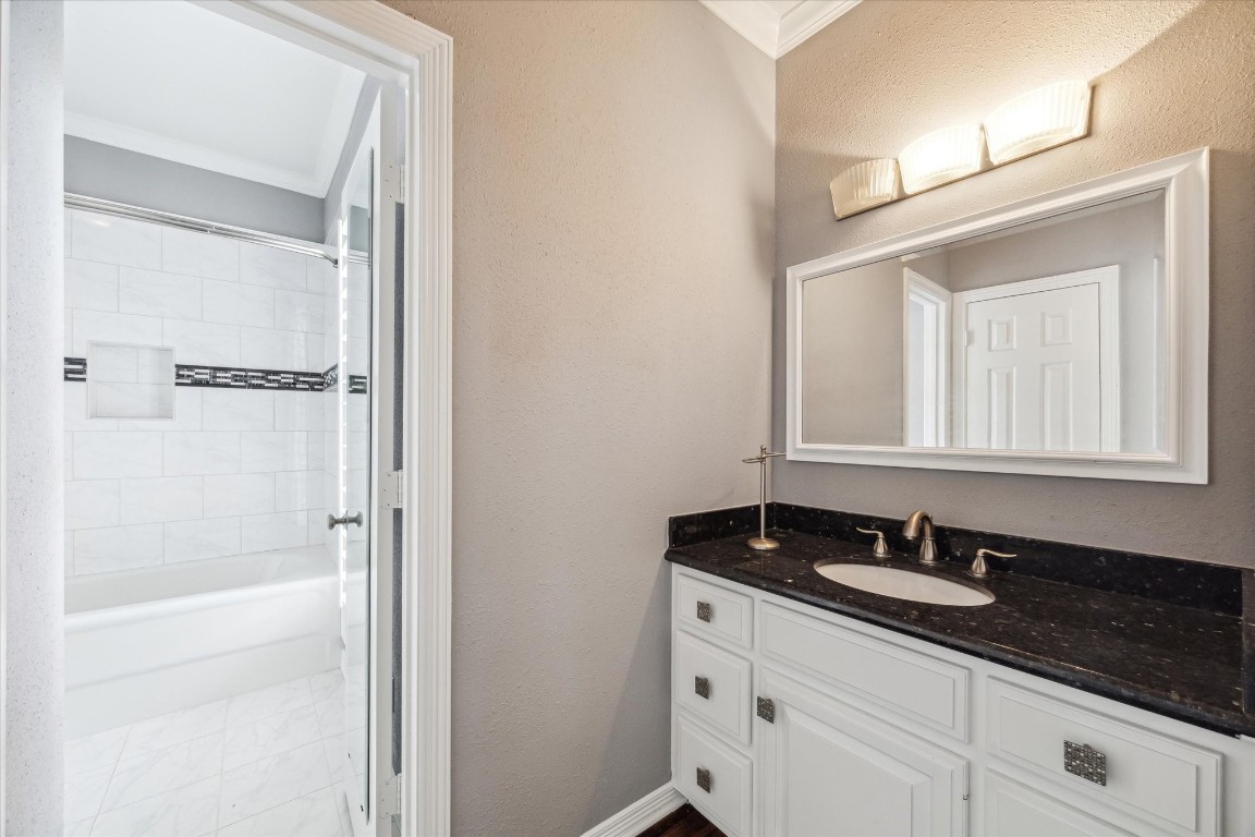 1406 Spring Cress Lane Seabrook, TX 77586 - Photo 29 of 50 a bathroom with a granite countertop sink and a mirror