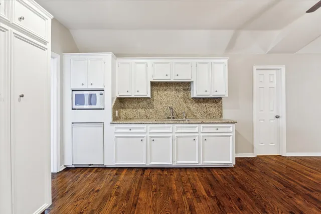 a view of a livingroom with wooden floor