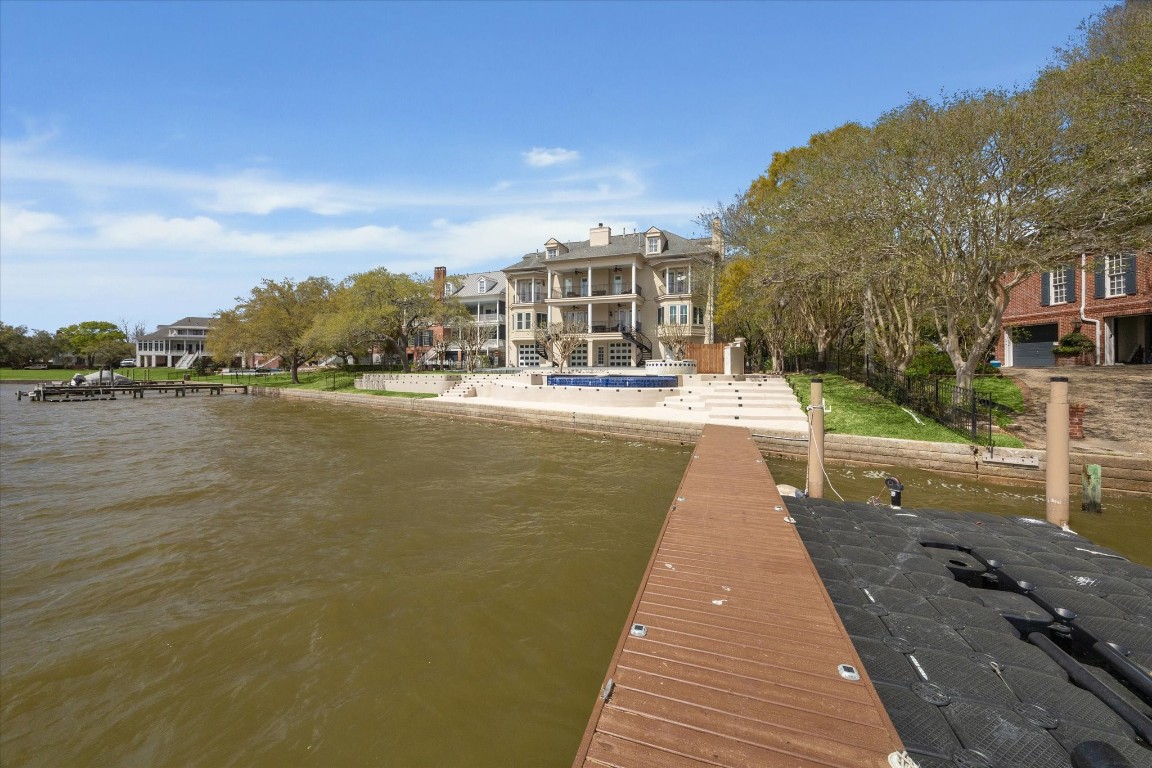 1406 Spring Cress Lane Seabrook, TX 77586 - Photo 45 of 50 a view of a lake with a city