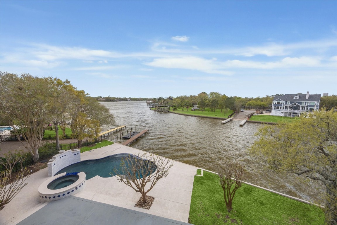 1406 Spring Cress Lane Seabrook, TX 77586 - Photo 48 of 50 a view of a lake with a yard