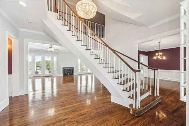 a view of a hallway view with wooden floor and staircase