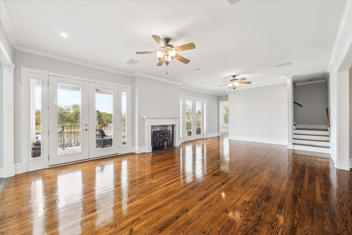 1406 Spring Cress Lane Seabrook, TX 77586 - Photo 8 of 50 a view of empty room with wooden floor and fireplace