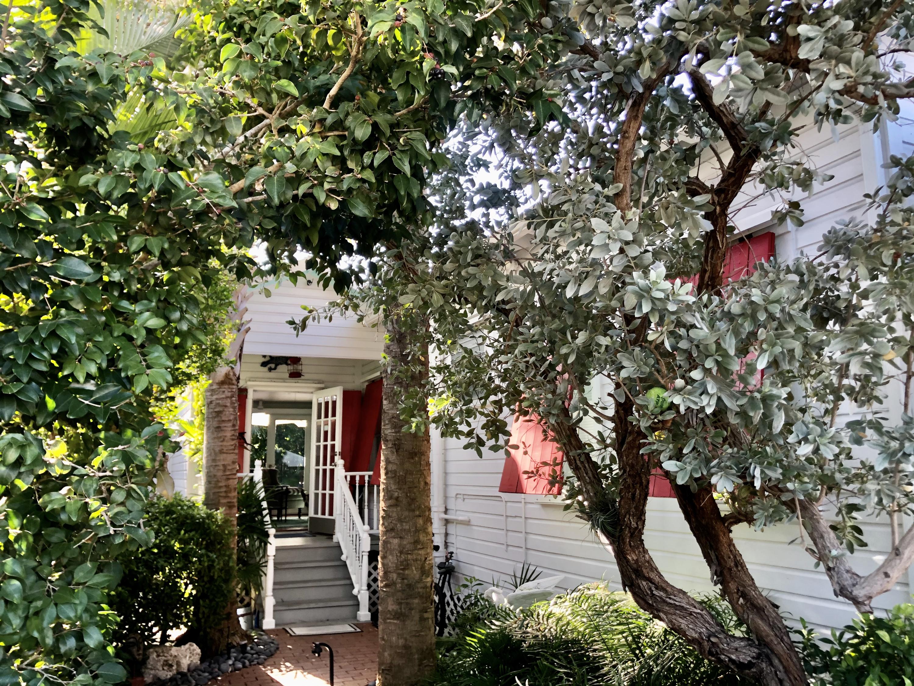 1118 Pearl Street Key West, FL 33040 - Photo 2 of 7 view of a house with a tree