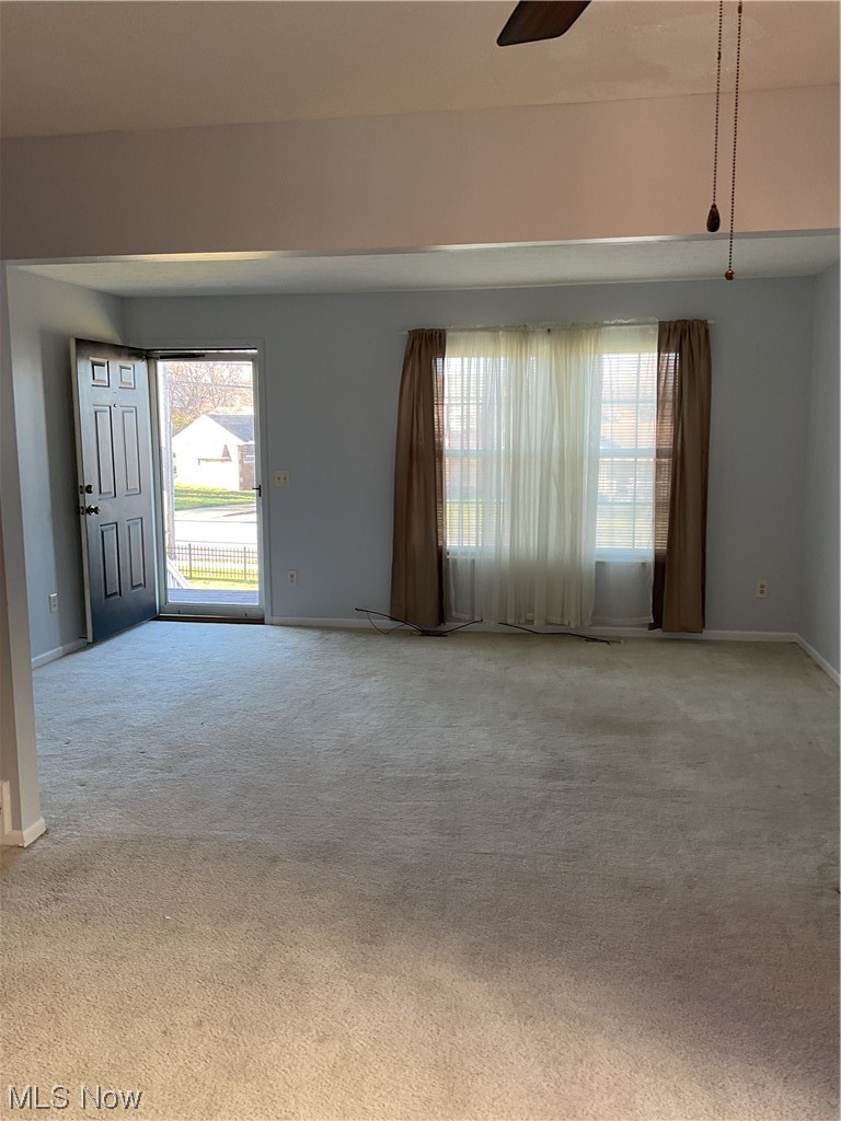 4422 Sexton Road Cleveland, OH 44105 - Photo 4 of 30 Carpeted spare room with ceiling fan