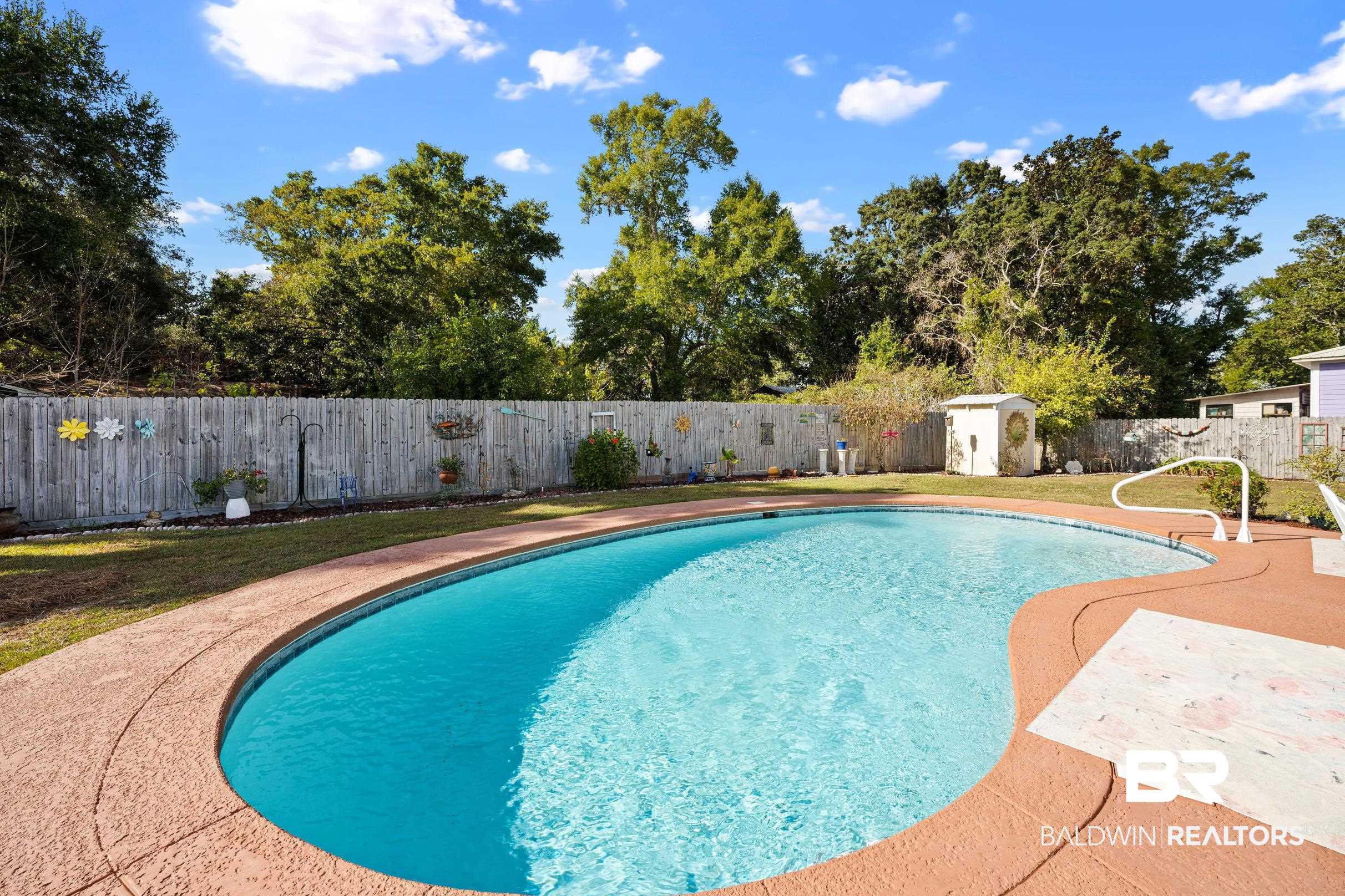 5217 Greentree Road Orange Beach, AL 36561 - Photo 24 of 58 View of pool with a fenced backyard, a shed, and a patio area