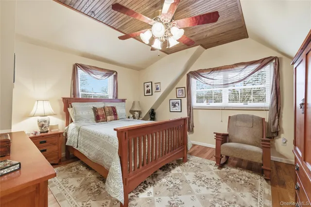 a bedroom with furniture and a window