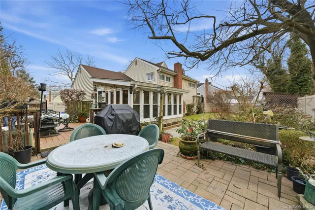 a view of a chairs and table in a patio