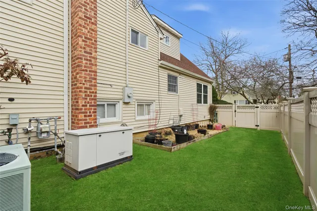 a view of a house with backyard sitting area and garden