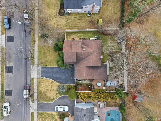 an aerial view of a house with outdoor space
