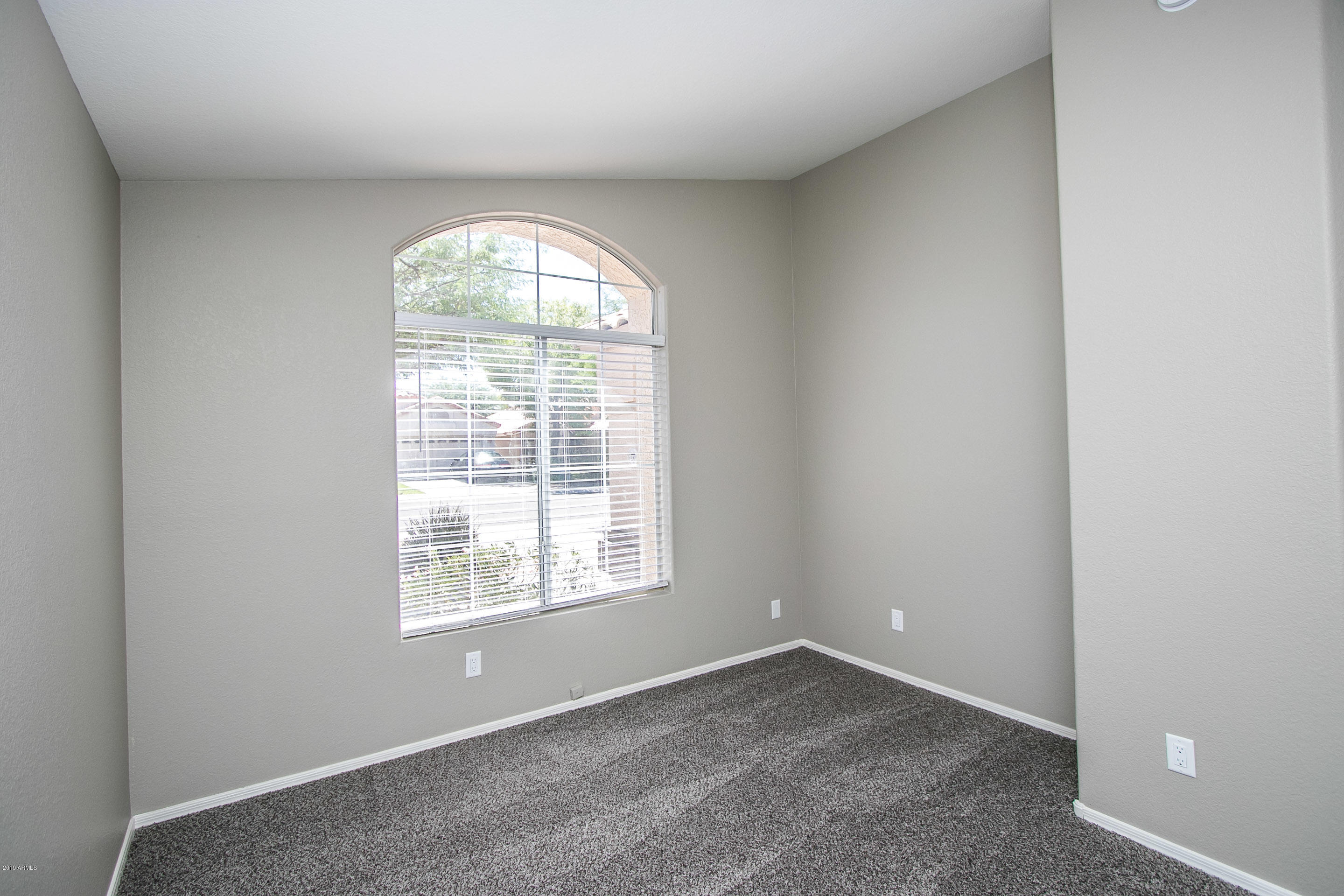 3948 East Stanford Avenue Gilbert, AZ 85234 - Photo 14 of 32 an empty room with a window