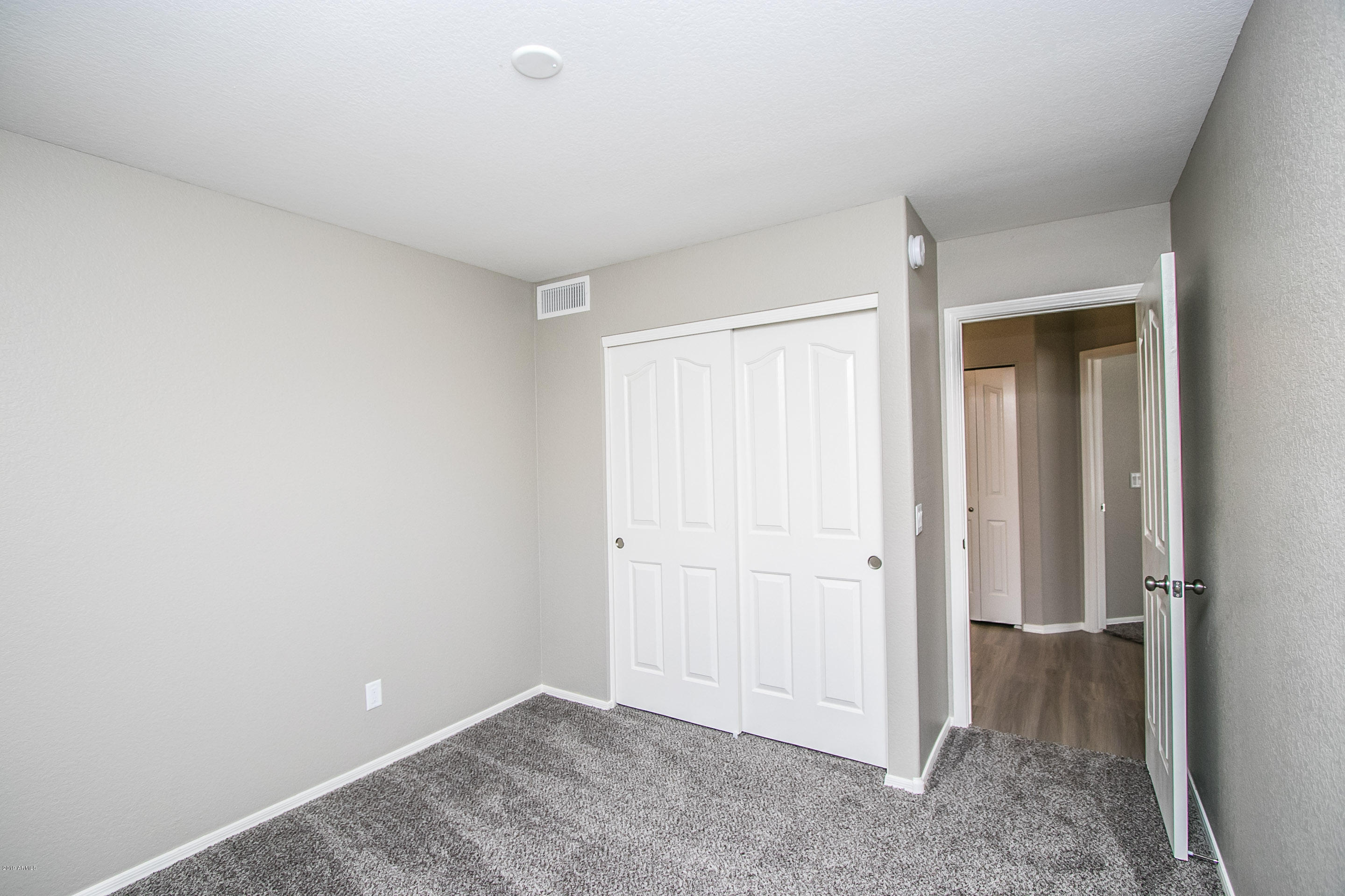 3948 East Stanford Avenue Gilbert, AZ 85234 - Photo 17 of 32 an empty room with closet area