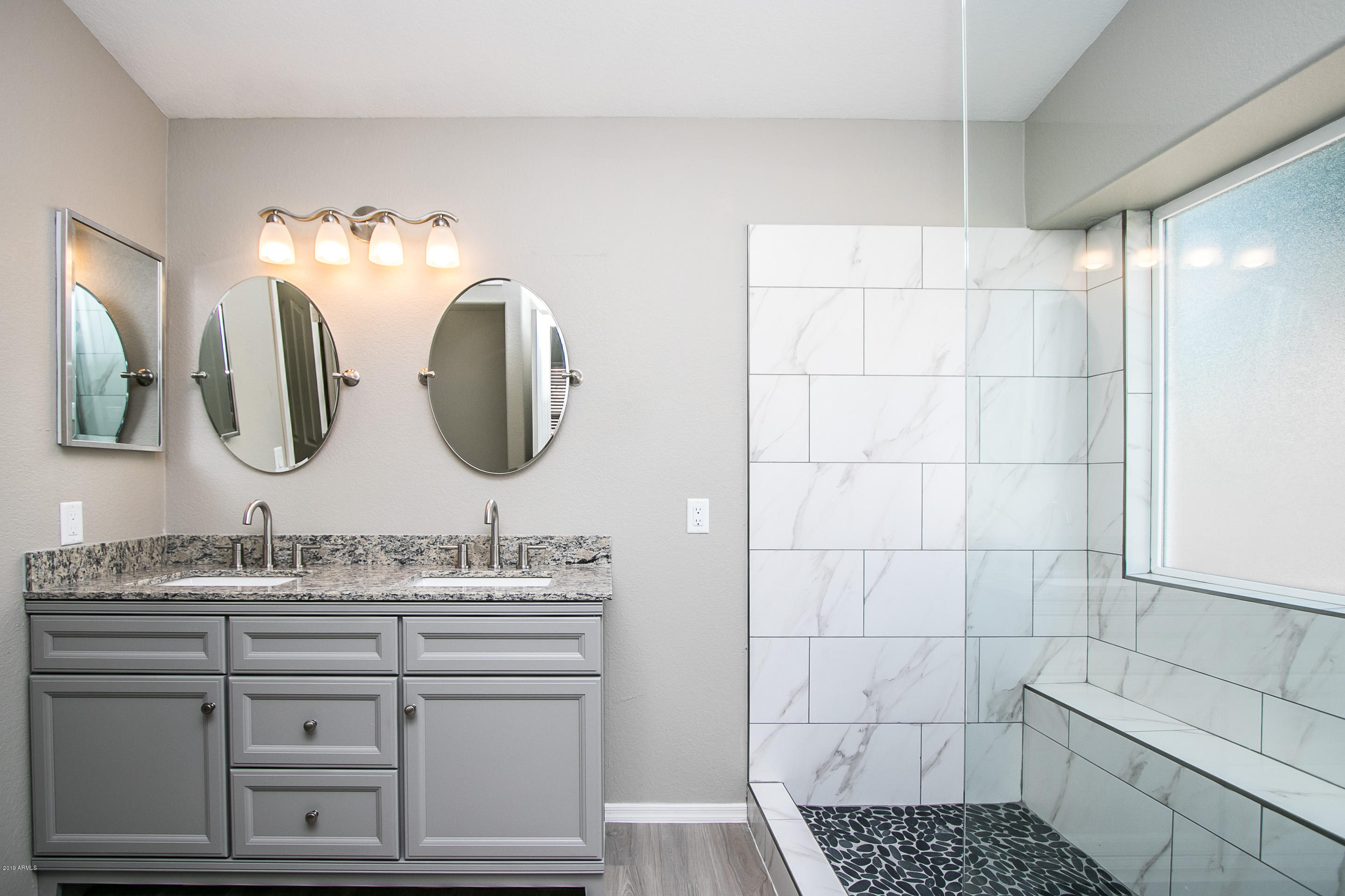3948 East Stanford Avenue Gilbert, AZ 85234 - Photo 22 of 32 a bathroom with a double vanity sink and a mirror